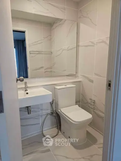 Modern bathroom with sleek fixtures and elegant marble tiles
