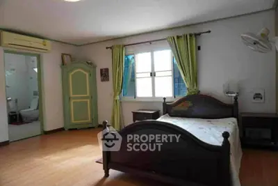 Spacious bedroom with ensuite bathroom and natural light