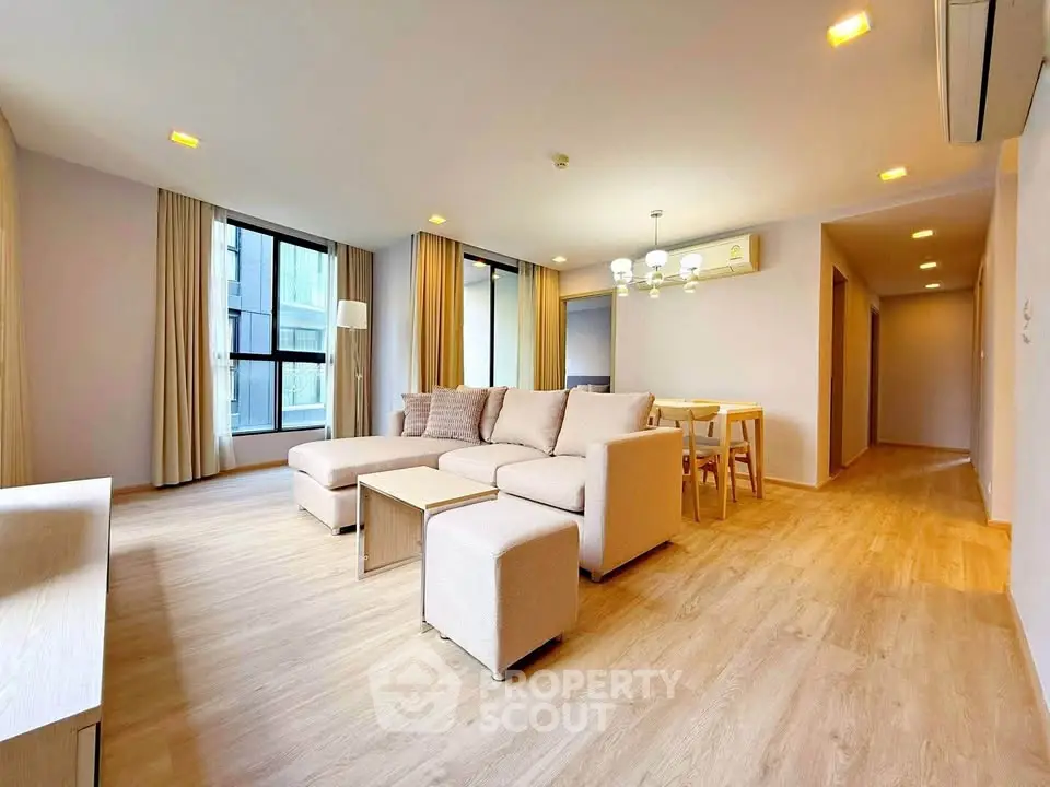 Spacious modern living room with elegant decor and natural light