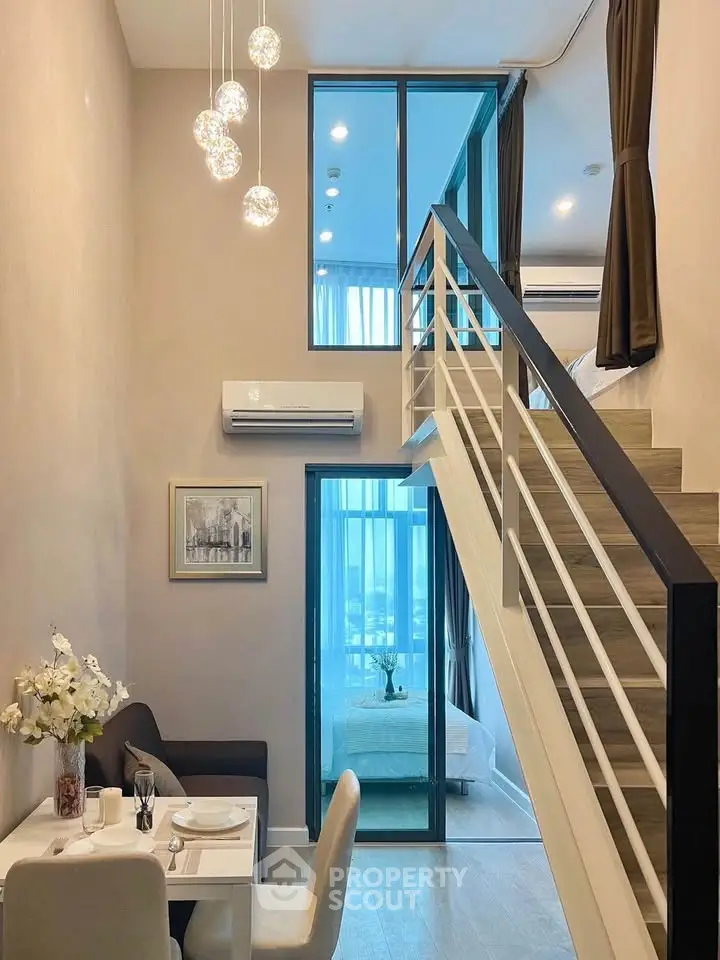 Modern loft apartment with stylish staircase and elegant dining area