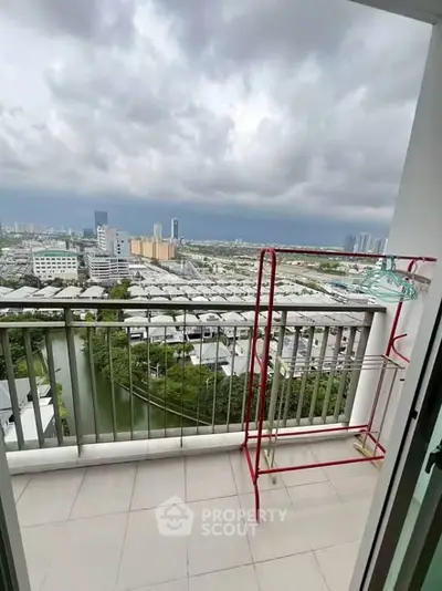 Stunning balcony view overlooking cityscape with ample space for relaxation.