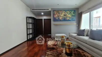 Spacious living room with modern decor and large window view in luxury apartment.