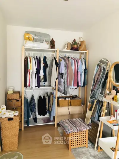 Spacious bedroom with organized closet and stylish decor