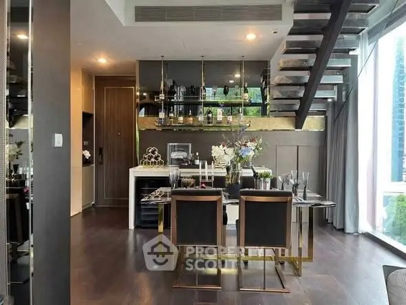 Luxurious modern dining area with elegant decor and open staircase in a high-end apartment.