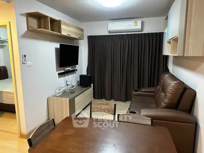 Cozy living room with modern furniture and air conditioning in a stylish apartment.