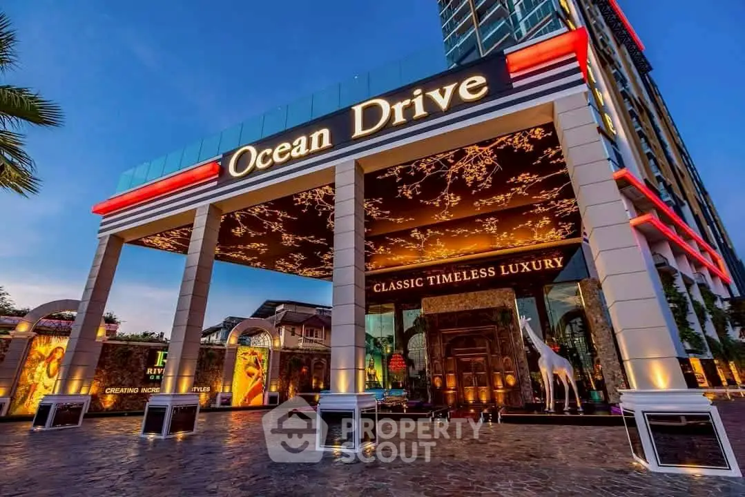 Luxurious building entrance with elegant design and vibrant lighting at Ocean Drive.
