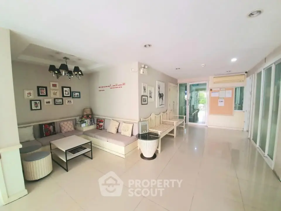 Modern apartment lobby with stylish seating and wall art