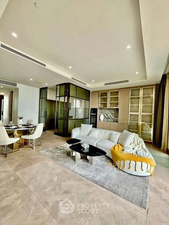Luxurious modern living room with elegant decor and spacious layout, featuring stylish furniture and ambient lighting.