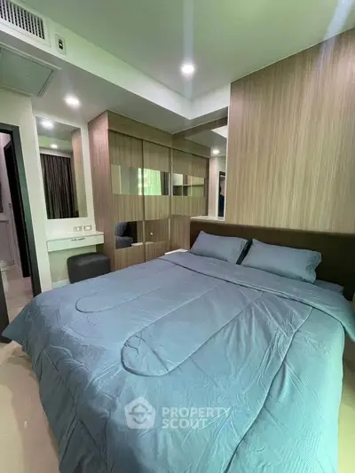 Modern bedroom with stylish wood paneling and cozy bedding