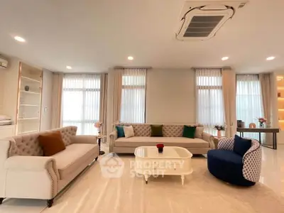 Luxurious living room with elegant sofas and modern decor, perfect for relaxation and entertaining.