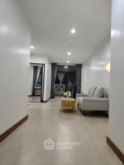 Spacious modern living room with elegant decor and natural light