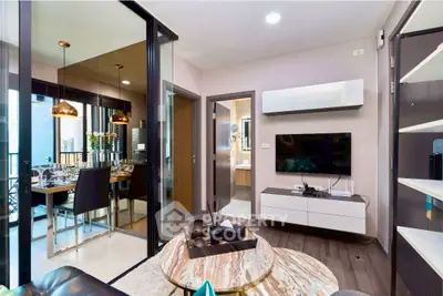 Modern living room with open layout and stylish dining area, featuring sleek furniture and contemporary decor.