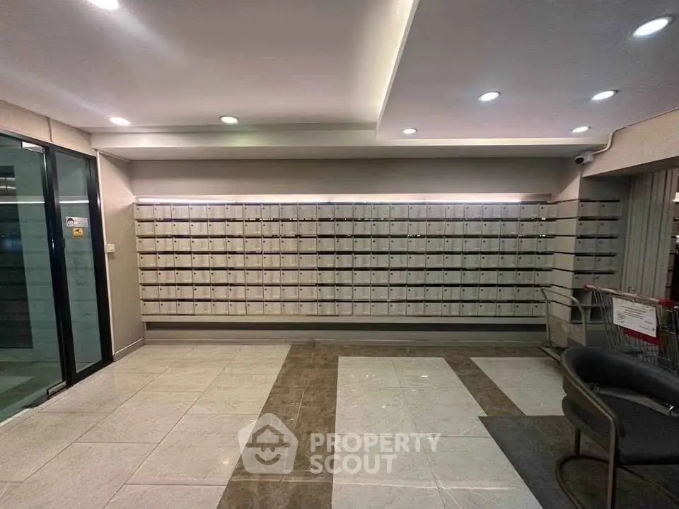 Modern apartment building lobby with mailboxes and sleek design