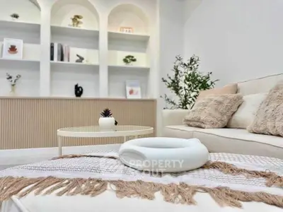 Stylish modern living room with cozy decor and elegant shelving