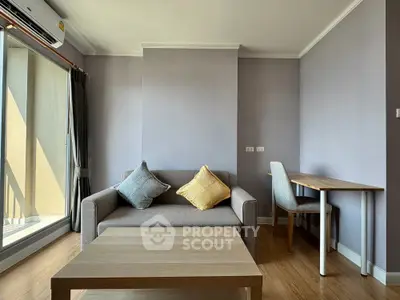 Modern living room with cozy sofa and natural light