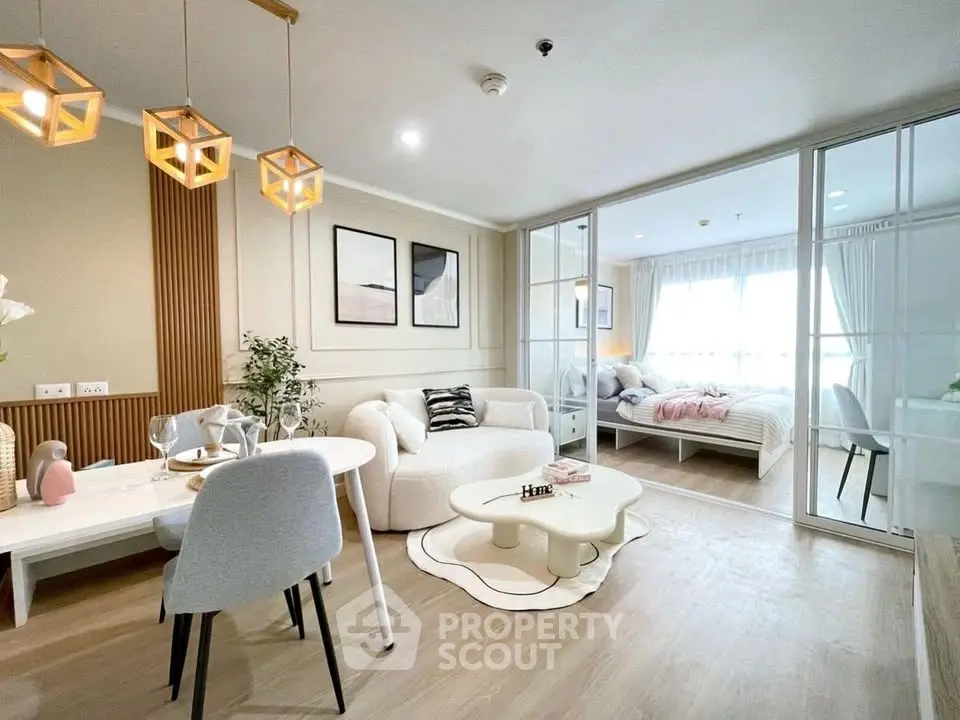 Modern open-plan living room with stylish decor and natural light