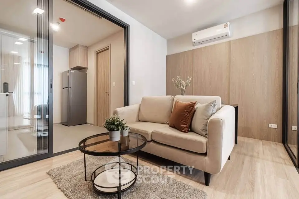 Modern living room with cozy sofa and stylish decor in a contemporary apartment.