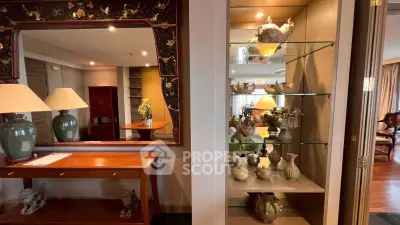 Elegant living room with decorative shelves and stylish furniture, perfect for sophisticated living.