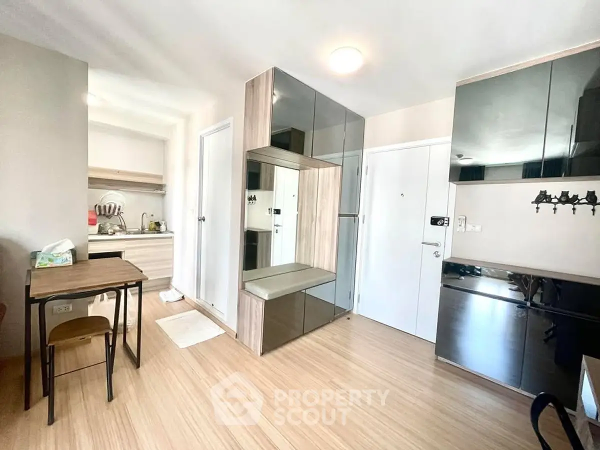 Modern apartment interior with sleek kitchen and stylish storage solutions
