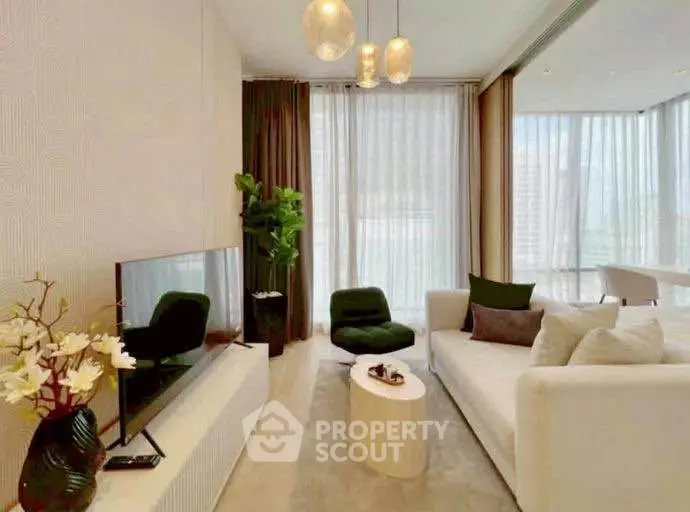 Modern living room with elegant decor and large windows in a luxury apartment.