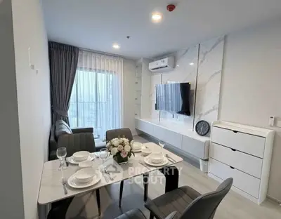 Modern living room with dining area, stylish decor, and natural light