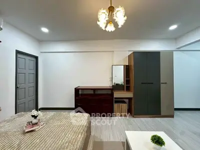 Modern bedroom with stylish furniture and elegant lighting in a cozy apartment.