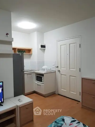 Cozy apartment interior with compact kitchen and modern decor