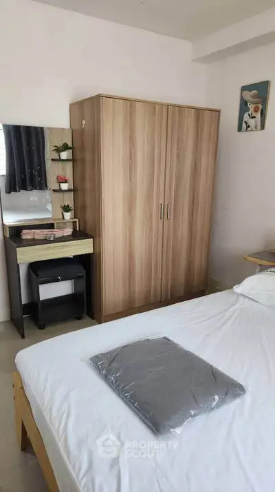 Cozy bedroom with wardrobe and dressing table, perfect for modern living.