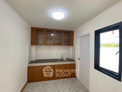 Modern kitchen with sleek cabinetry and ample natural light