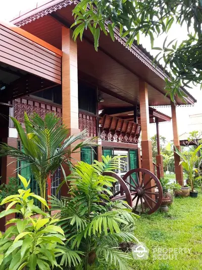 Charming traditional house with lush garden and rustic wooden accents