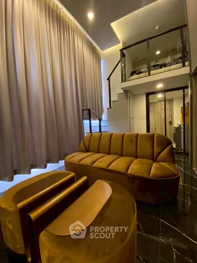 Luxurious loft-style living room with elegant furniture and high ceilings