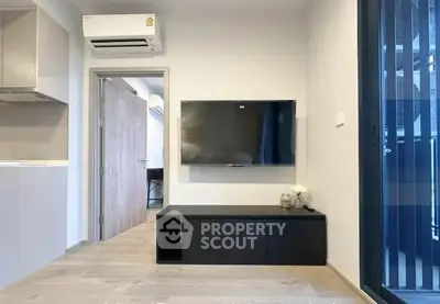 Modern living room with wall-mounted TV and sleek air conditioning unit