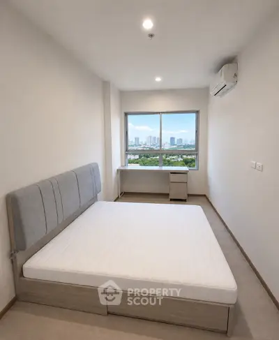 Modern bedroom with city view, featuring minimalist design and natural light.