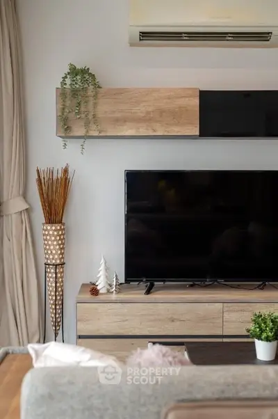 Modern living room with stylish TV setup and elegant decor