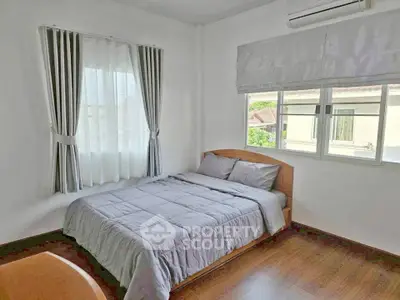 Cozy bedroom with natural light and modern decor
