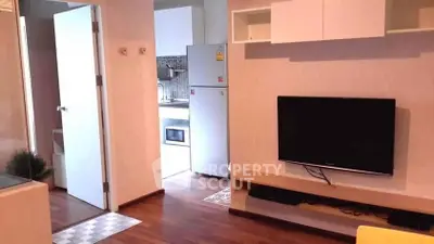 Modern apartment interior with sleek kitchen and cozy living area