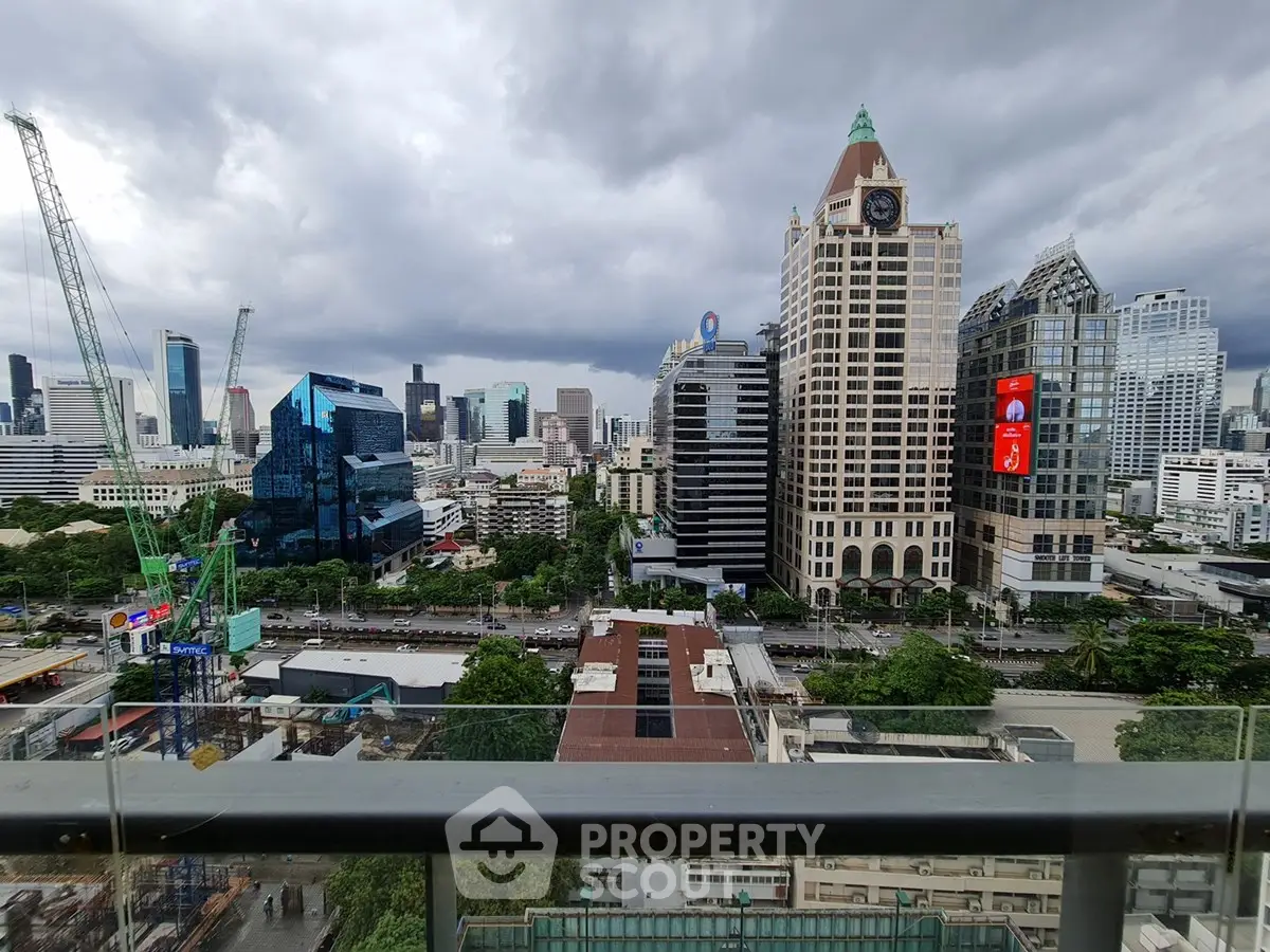 Stunning cityscape view from a high-rise balcony showcasing modern architecture and urban skyline.