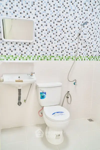 Modern bathroom with stylish mosaic tiles and sleek fixtures