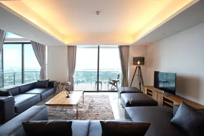 Luxurious living room with panoramic city view and modern furnishings