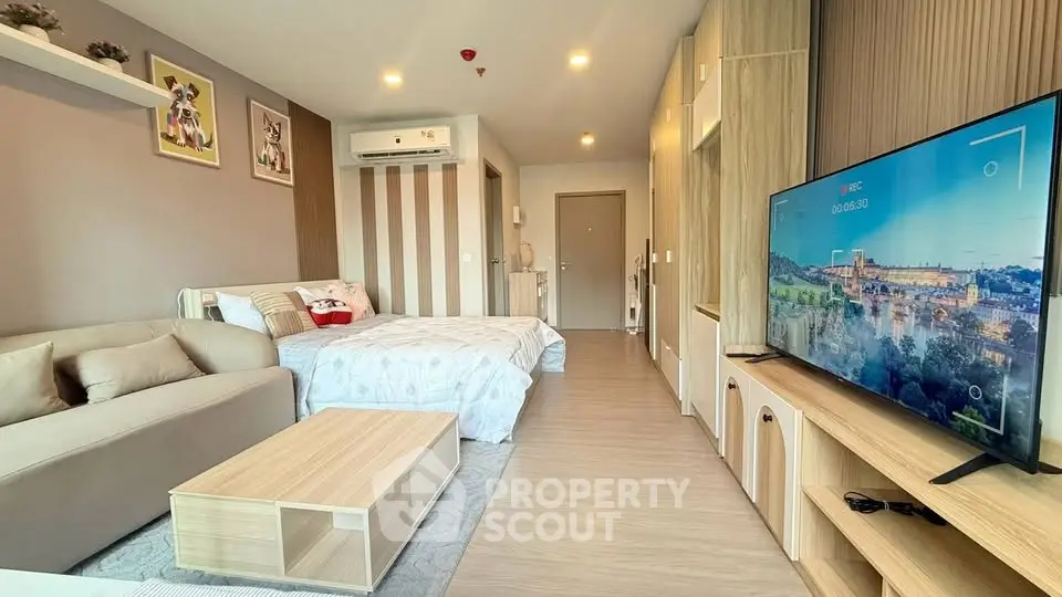 Modern studio apartment with cozy living area and stylish decor