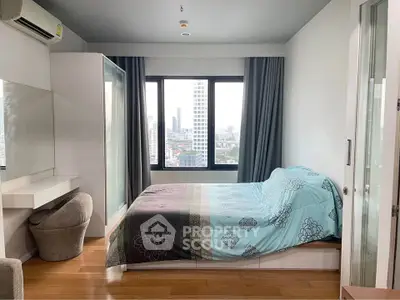 Modern bedroom with city view, featuring stylish decor and ample natural light.