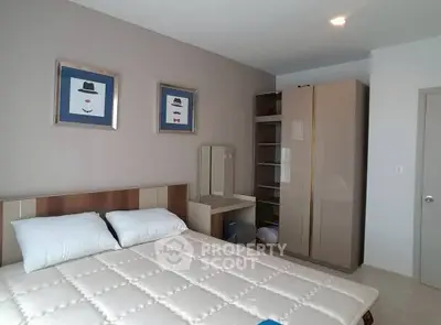 Modern bedroom with stylish decor and ample storage space