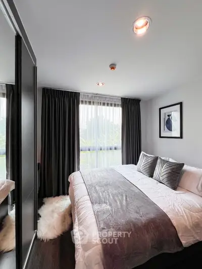 Modern cozy bedroom with large window and stylish decor