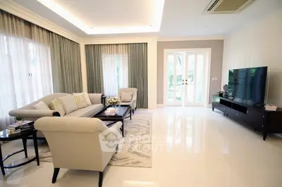 Luxurious living room with elegant furniture and large windows