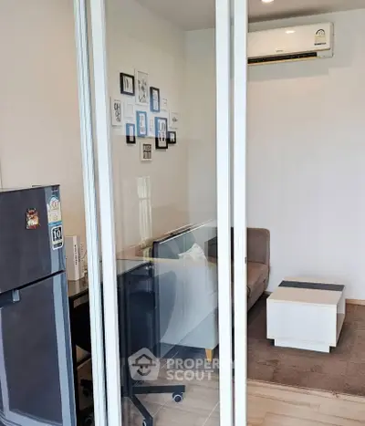 Modern compact living room with glass partition and air conditioning