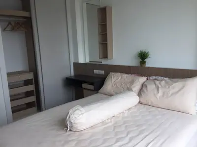 Cozy bedroom with modern furnishings and ample storage space
