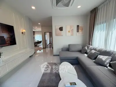 Modern living room with stylish decor and ample natural light
