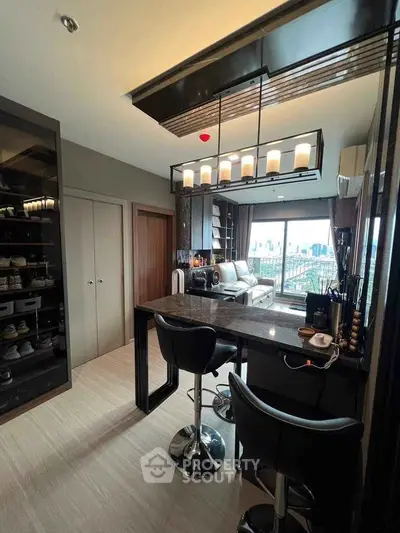 Modern open-layout kitchen with stylish bar stools and city view