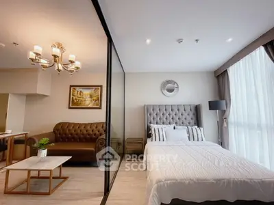 Luxurious modern bedroom with elegant decor and spacious living area in a stylish apartment.