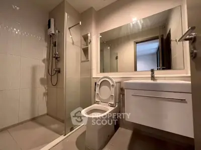 Modern bathroom with sleek fixtures and spacious shower area